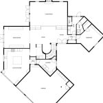 Black and white floor plan showing a layout with a garage, laundry, kitchen, dining room, living room, foyer, one bedroom, and bathroom, along with a stairway and multiple entry points.